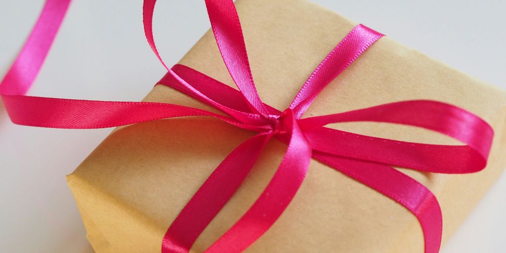 brown gift box with pink ribbon