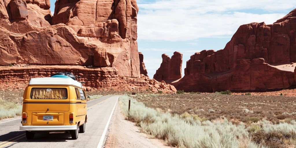 yellow Volkswagen van on road